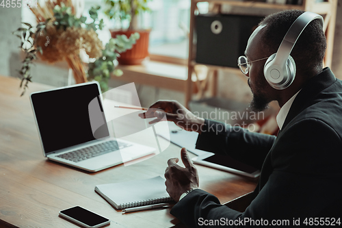 Image of Businessman or student working from home while being isolated or keep quarantine \'cause of coronavirus COVID-19