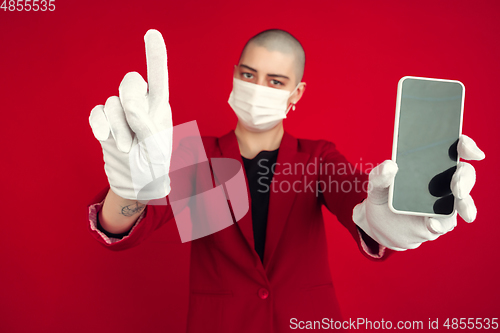 Image of Portrait of young caucasian bald woman on red background