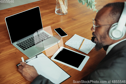 Image of Businessman or student working from home while being isolated or keep quarantine \'cause of coronavirus COVID-19