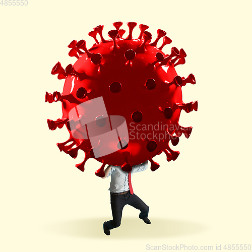 Image of Man headed by model of COVID-19 coronavirus, concept of pandemic spreading