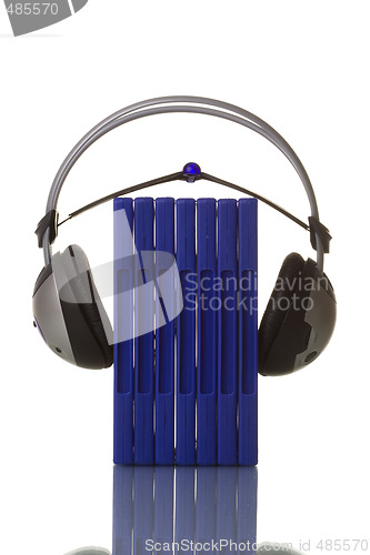 Image of headphones holding blue dvd cases 