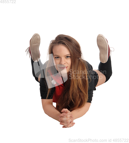 Image of Pretty woman lying on her stomach on the floor
