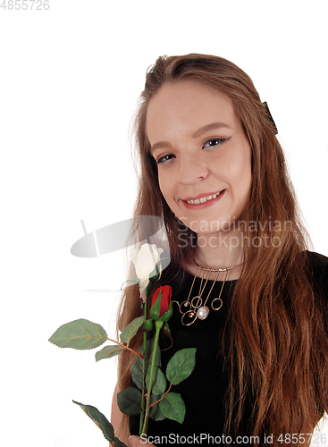 Image of Beautiful woman in black dress with rose
