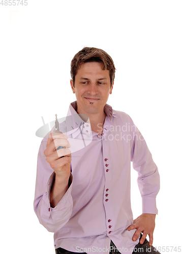 Image of Happy young man with the car key, smiling