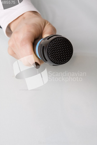 Image of hand with microphone