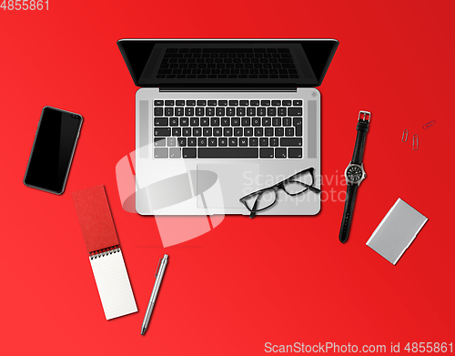 Image of Office desk mockup top view isolated on red