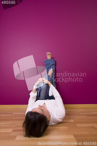 Image of woman relaxing in the floor