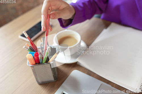 Image of Young caucasian business woman working in office, diversity and girl power concept, close up