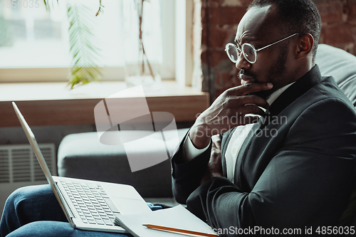 Image of Businessman or student working from home while being isolated or keep quarantine \'cause of coronavirus COVID-19