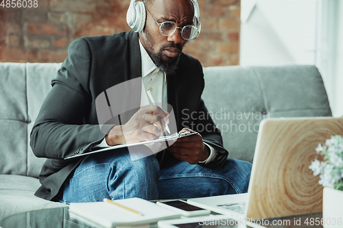 Image of Businessman or student working from home while being isolated or keep quarantine \'cause of coronavirus COVID-19