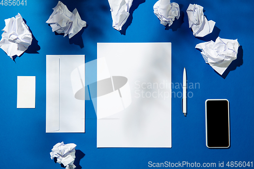 Image of Creative and cozy workplace at home office, inspirational mock up with plant shadows on table surface