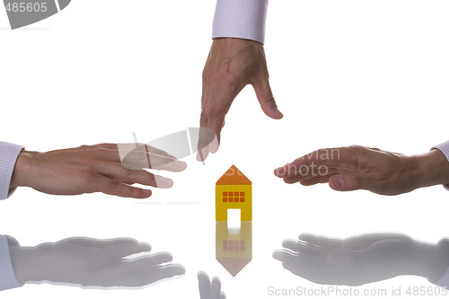 Image of Three hands trying to reach a house