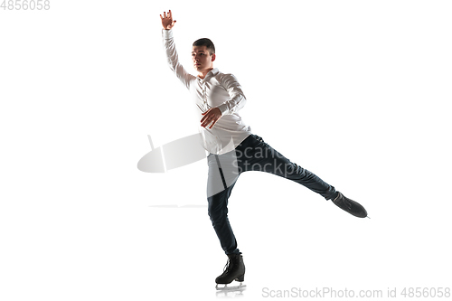 Image of Man figure skating isolated on white studio backgound with copyspace