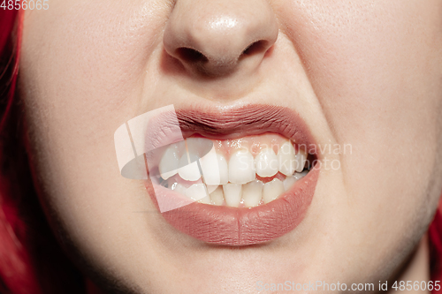 Image of Close-up female mouth with natural lips make-up. Cosmetology, dentistry and beauty care, human emotions