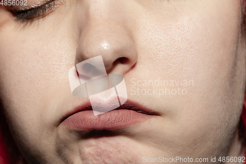 Image of Close-up female mouth with natural lips make-up. Cosmetology, dentistry and beauty care, human emotions