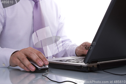 Image of businessman working with his laptop