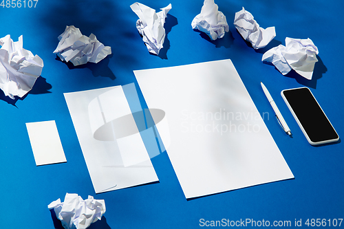 Image of Creative and cozy workplace at home office, inspirational mock up with plant shadows on table surface