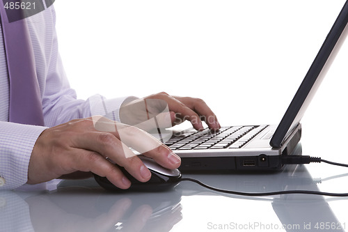 Image of businessman working with his laptop