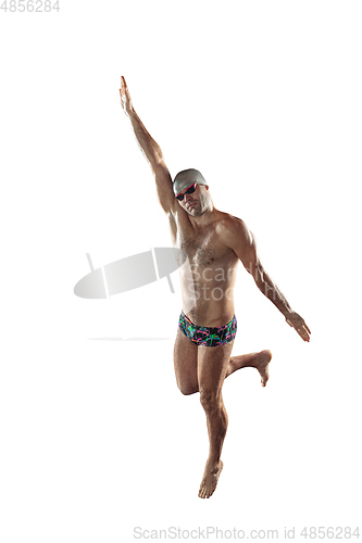 Image of Professional male swimmer with hat and goggles in motion and action, healthy lifestyle and movement concept