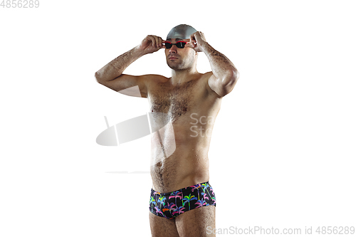 Image of Professional male swimmer with hat and goggles in motion and action, healthy lifestyle and movement concept