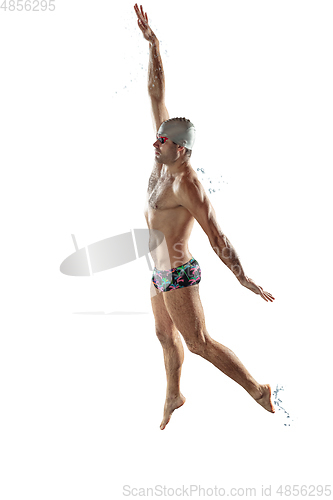Image of Professional male swimmer with hat and goggles in motion and action, healthy lifestyle and movement concept