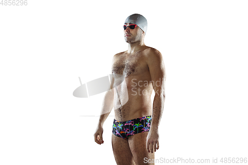 Image of Professional male swimmer with hat and goggles in motion and action, healthy lifestyle and movement concept