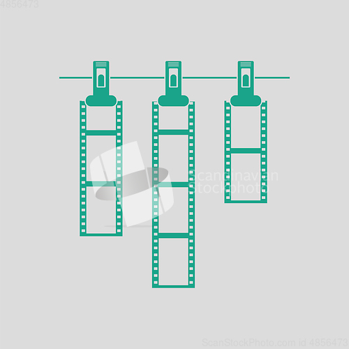 Image of Icon of photo film drying on rope with clothespin