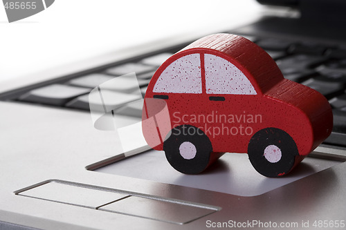 Image of toy car on a laptop