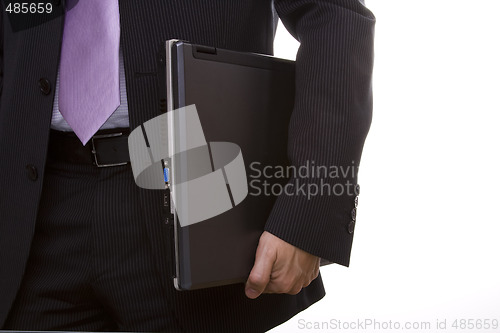 Image of businessman holding a laptop