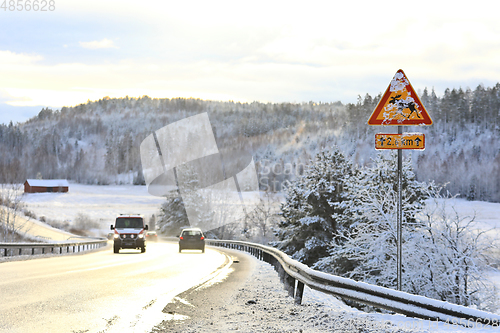 Image of Moose Warning Traffic Sign in Winter Snow