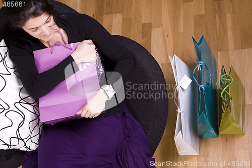 Image of woman showing her shopping bags