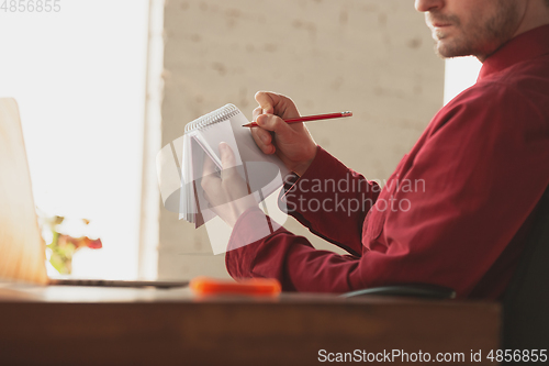 Image of Caucasian entrepreneur, businessman, manager working in office, close up