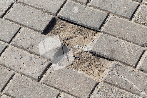 Image of pedestrian tiles broken