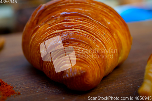 Image of french traditiona croissant brioche butter bread  on wood