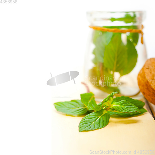 Image of fresh mint leaves on a glass jar