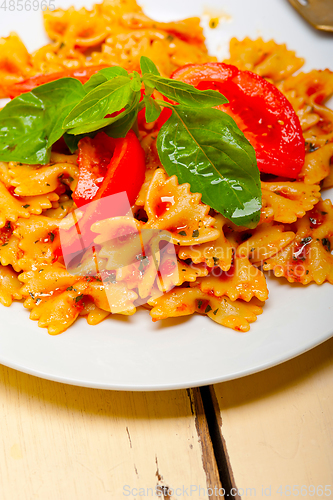 Image of Italian pasta farfalle butterfly bow-tie and tomato sauce