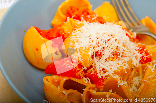 Image of Italian snail lumaconi pasta with tomatoes