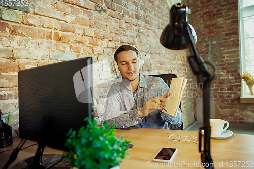 Image of Man working from home during coronavirus or COVID-19 quarantine, remote office concept