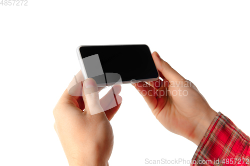 Image of Close up of man using mobile smartphone isolated on white studio background