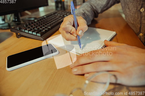 Image of Man working from home during coronavirus or COVID-19 quarantine, remote office concept