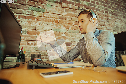 Image of Man working from home during coronavirus or COVID-19 quarantine, remote office concept