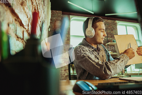 Image of Man working from home during coronavirus or COVID-19 quarantine, remote office concept