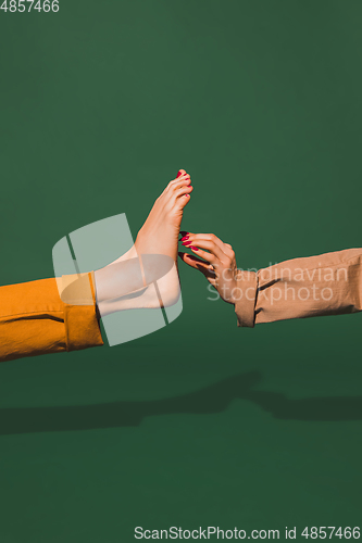 Image of Bright fashionable hand and leg working up daily things together. Modern artwork, contemporary art