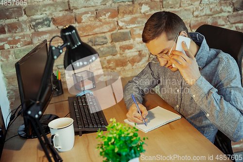 Image of Man working from home during coronavirus or COVID-19 quarantine, remote office concept