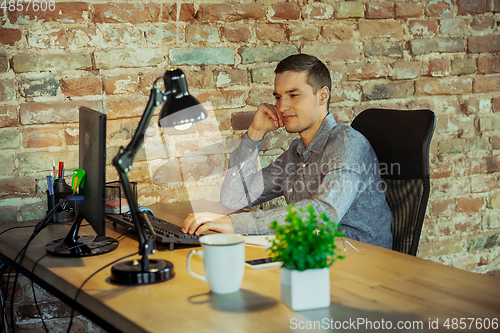 Image of Man working from home during coronavirus or COVID-19 quarantine, remote office concept