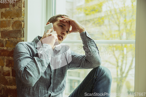 Image of Man working from home during coronavirus or COVID-19 quarantine, remote office concept