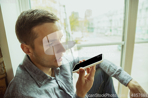 Image of Man working from home during coronavirus or COVID-19 quarantine, remote office concept