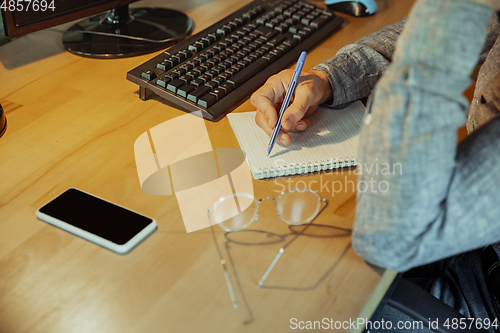 Image of Man working from home during coronavirus or COVID-19 quarantine, remote office concept