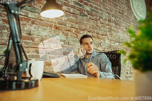 Image of Man working from home during coronavirus or COVID-19 quarantine, remote office concept