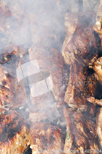 Image of Cooking meat on grill